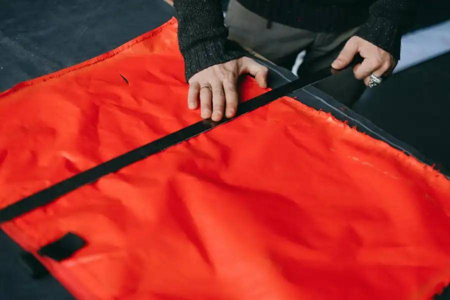 Red fabric banner on black fabric background